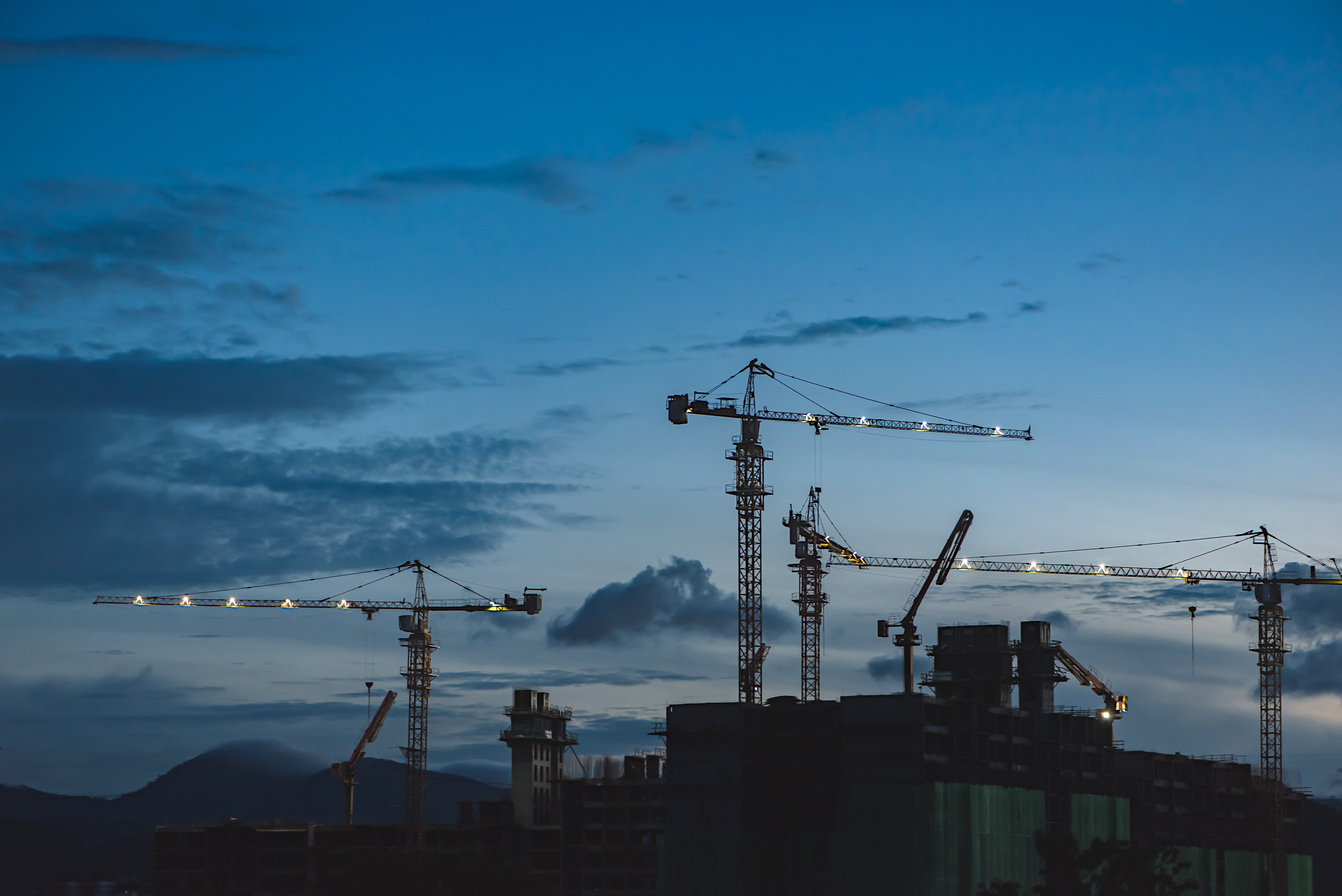 Image shows a construction site at twilight