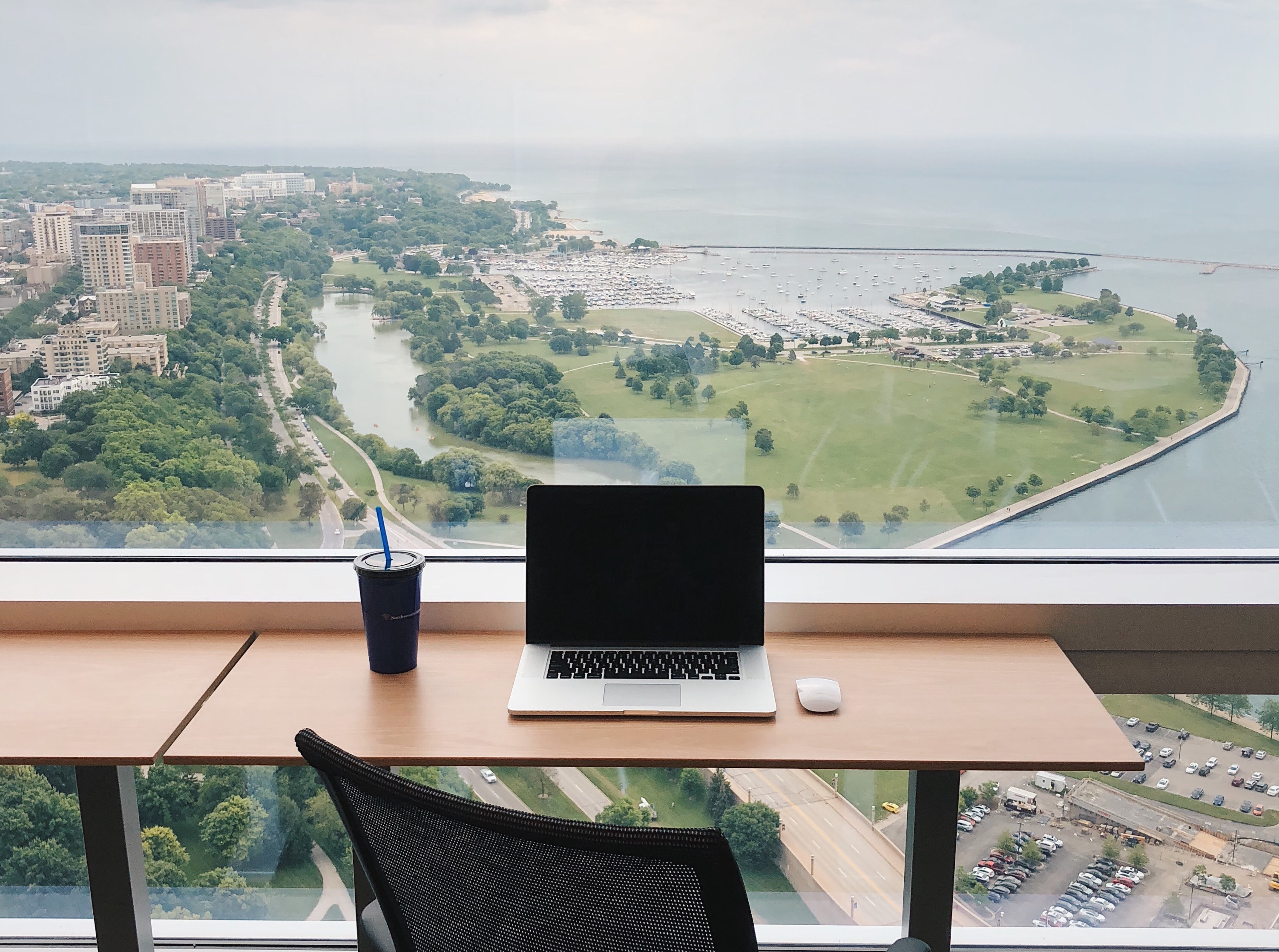 Computer in front of a view of lovely properties